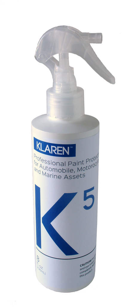 A white, tall 8 ounce bottle of Klaren's finest automotive spray sealant with liquid ceramic technology.